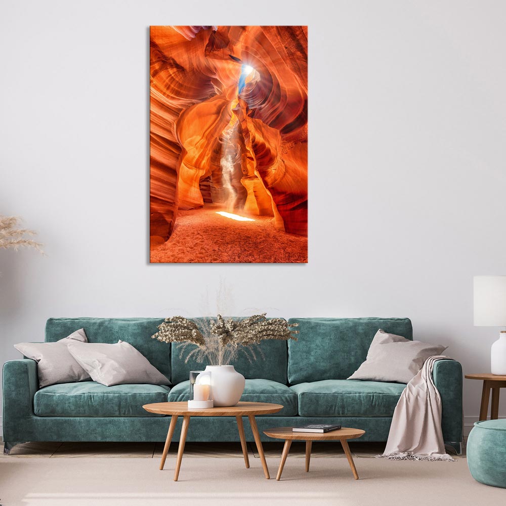 Leinwandbild "Sonnenstrahlen in den Canyon" im Wohnzimmer mit blauer Couch