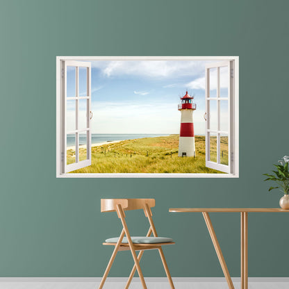 Leinwandbild für Essbereich mit geöffnetem Fenstermotiv und Blick auf idyllische Dünenlandschaft mit Leuchtturm